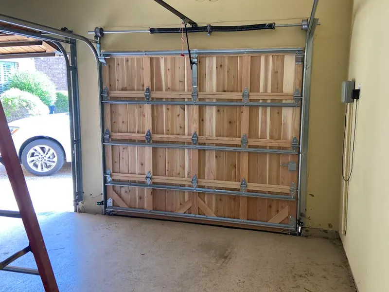 Timber carriage-style garage door seen from inside the garage